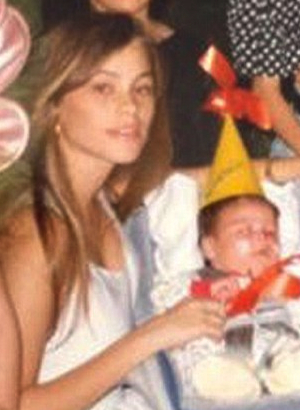 young sofia vergara next to infant son