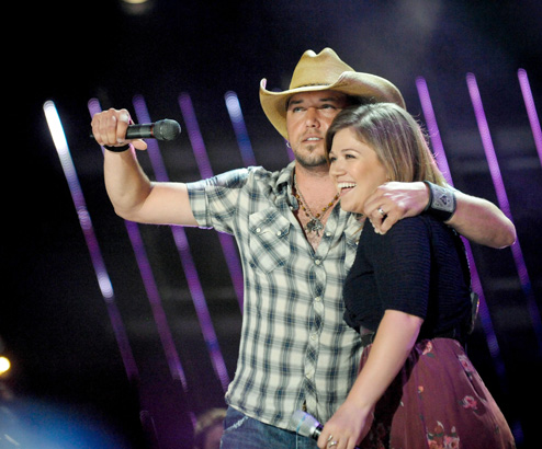 Jason Aldean performs with Kelly Clarkson at the 2011 CMA Music Festival LP Field on June 9, 2011 in Nashville, Tennessee