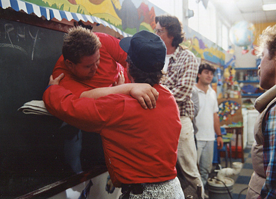 Photo of Eric Edwards getting taped up on the chalkboard